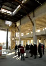 Tour members examine the area which will be used as the Hall of Champions in the new North Endzone Facility.