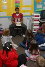 Justin Carrington reads to students during Read Across America festivities.