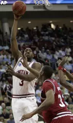 ana's D.J. White (3) shoots the ball over Vincent Hunter (33) during the first half of a first round (AP Photo)