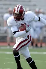 Junior wideout Ray Fisher sprints upfield at Friday's practice.