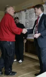 Head coach Mike Mayer accepts the championship trophy at the UMB Bank-Mizzou Tiger Classic.