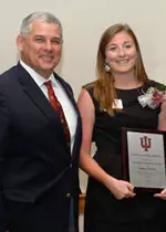 Women's soccer player Katy Stewart poses with Athletic Director Rick Greenspan after receiving her 2007-2008 Scholastic Achievement award