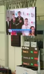 Kurt Bassett's gold-medal time of 1:59.67 in the 200 backstroke is a school record.