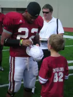 Head coach Bill Lynch and the players remained on the field after the scrimmage to take pictures and sign autographs for the fans in attendance.