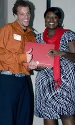 Sophomore cross country and track and field standout De'Sean Turner and IU Assistant Athletics Director for Student Development Mattie White.