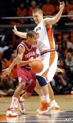 Verdell Jones tries to get around Illinois' Richard Semrau in the first half. (AP Photo/John Dixon)