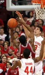 Devan Dumes attacks the basket during the first half.