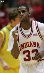 Devan Dumes reacts after hitting a 3-pointer during the first half.