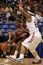Indiana's Maurice Creek, left, drives against Ole Miss' Trevor Gaskins. (AP)