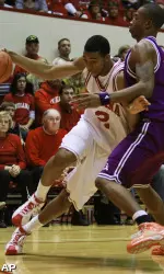 Indiana forward Christian Watford, left, drives to the basket against Northwestern State center William Mosley. (AP)