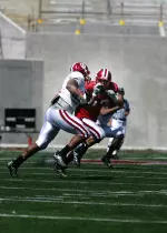 Trea Burgess carried the ball 13 times for 65 yards in the team's first scrimmage.