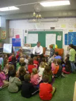 Head coach Bill Lynch visited with first and second graders at Rogers Elementary School on Wednesday afternoon.