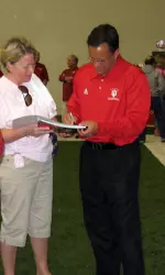 Indiana Coach Tom Crean signs autographs at the Fan Appreciation Tailgate.