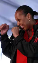 Women's Basketball Head Coach Felisha Legette-Jack smiles while joking with the audience.