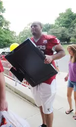 James Brewer helps move a tv into Foster Quad.