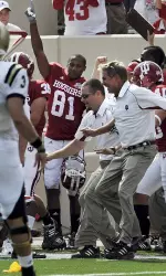 Indiana coach Bill Lynch and players celebrate in the final seconds of the team's 23-19 win over Western Michigan. (AP Photo/The Herald-Times, Chris Howell)