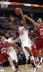 Ohio State's David Lighty (23) goes to the basket between Indiana's Tom Pritchard (25) and Verdell Jones III (12) during the first half of an NCAA college basketball game Wednesday, Jan 6, 2010, in Columbus, Ohio. Ohio State's Dallas Lauderdale, rear left, looks on. (AP Photo/Terry Gilliam)