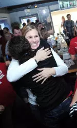 Head Coach Sherry Dunbar celebrates after seeing 'Indiana' pop up on the bracket