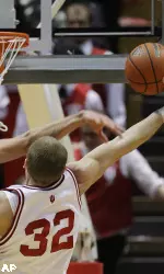 Indiana forward Derek Elston (32) is fouled by Northwestern guard Drew Crawford as he goes up for a shot during the first half of an NCAA college basketball game in Bloomington, Ind., Saturday, March 6, 2010. (AP Photo/Darron Cummings)