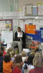 IU cornerback Adrian Burks participates in Read Across America at a local school.