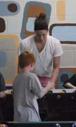 Sam Thrower playing games with the children at the Boys and Girls Club