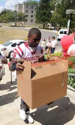 Running back Nick Turner helps a new Hoosier move into Foster Quad.