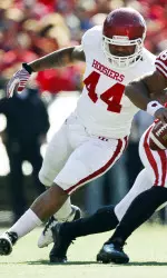 Wisconsin quarterback Russell Wilson (16) outruns Indiana defensive end Darius Johnson (44) during the first half. (AP Photo/Andy Manis)