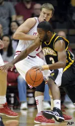 Indiana's Jordan Hulls defends as UMBC's Quentin Jones drives to the basket.