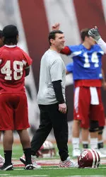 Co-defensive coordinator Mike Ekeler works with Indiana's linebackers at spring practice.