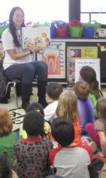 Kristiana Stauere reads to a kindergarten class at Highland Park Elementary School.
