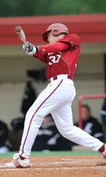 Senior pitcher Matt Carr takes a cut in the batters' box