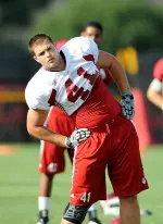 Fifth-year senior tight end Max Dedmond warms up before Wednesday's practice.
