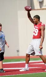 Senior Chris Adkins teaches one youngster some moves at the end zone celebration station.