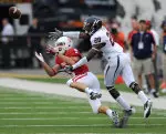 Cornerback Greg Heban makes the first of his two interceptions against Virginia.