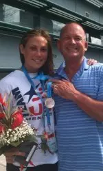 Cassie Wyckoff with her father, Travis, and the silver medal.