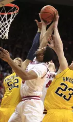 Indiana's Christian Watford, middle, vies with Michigan's Jordan Morgan, left, and Evan Smotrycz for a rebound during the first half. (AP Photo/Darron Cummings)