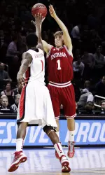 Jordan Hulls shoots over Georgia's Kentavious Caldwell-Pope.