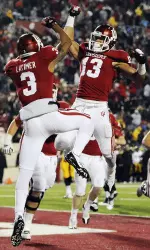 Wide receivers Cody Latimer (3) and Kofi Hughes (13) celebrate one of Latimer's three touchdowns in the game