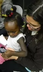 Freshman Colleen Smith with a young attendee of the clinic.