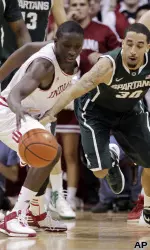 Victor Oladipo fights for a loose ball.