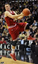 Jordan Hulls saves a loose ball.