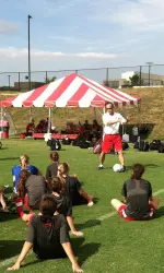 Coach Lyon instructs the team at the end of practice on Friday.