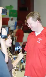 Head Coach Ray Looze speaks with Cynthia Potter at last year's dual meet vs. Purdue.