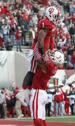 Cody Latimer (3) lifts wide receiver Shane Wynn (1) after scoring a touchdown. (Pat Lovell-USA TODAY Sports)