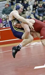 Heavyweight Adam Chalfant plants his opponent in the opening period