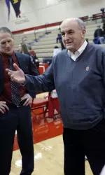 Indiana University President Michael A. McRobbie visits with the Hoosier wrestling team earlier this season.