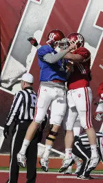 Quarterback Nate Sudfeld and tight end Anthony Corsaro celebrate a touchdown at Thursday's scrimmage.