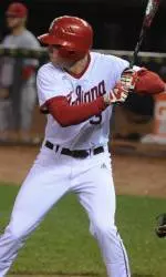 Scott Donley high fives an IU fan before hopping on the bus