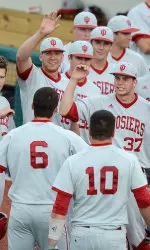 Teammates congratulate Sam Travis after his homerun in the second inning