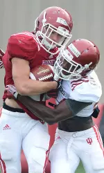 Senior Tim Bennett (white jersey) is fitting in nicely at cornerback.